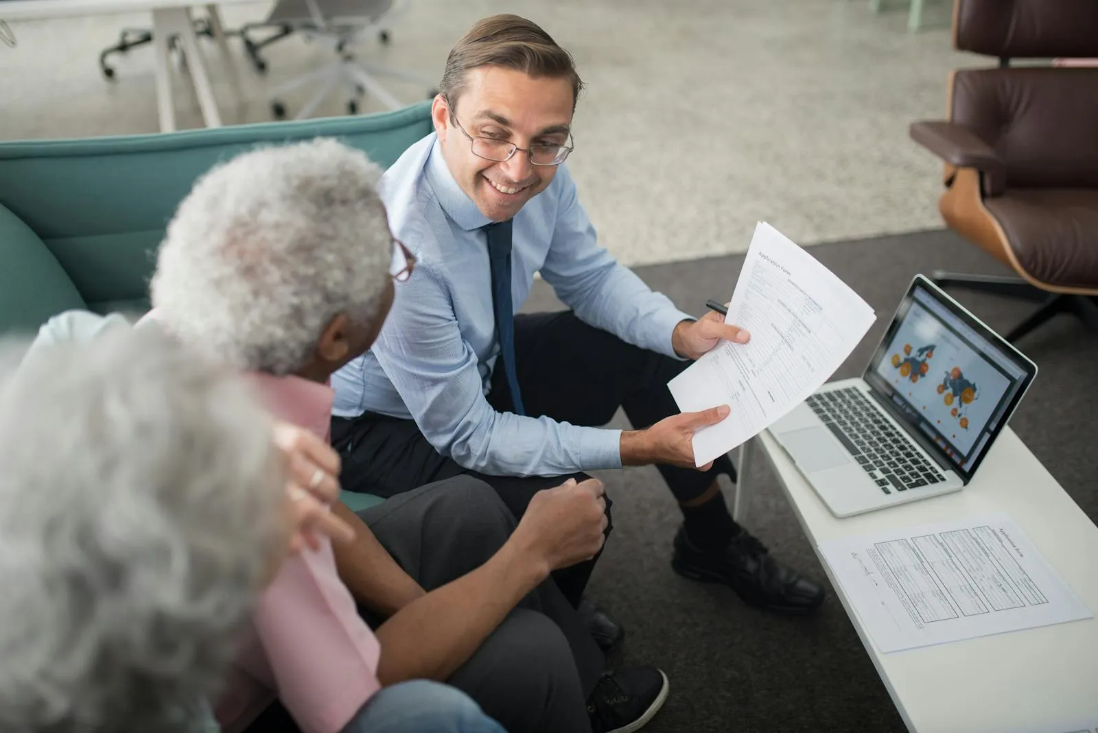 Financial advisor reviewing a plan with a mature couple